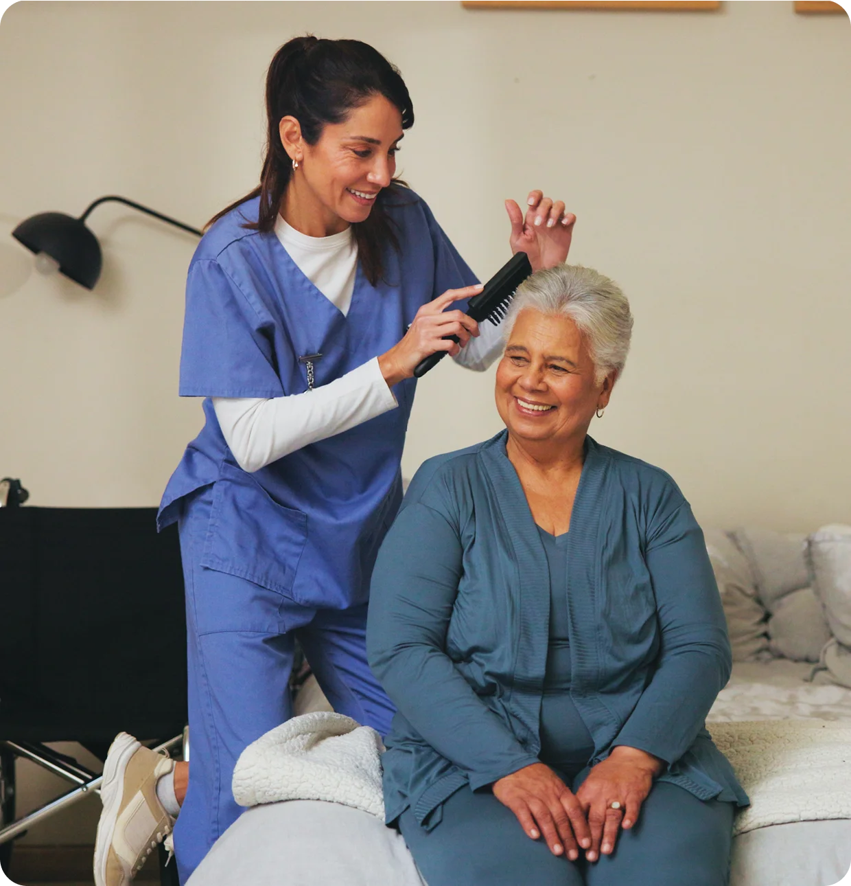 Nurse assisting senior woman at home